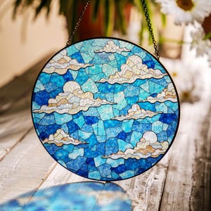 Stained blue sky cloud glass suncatcher with dreamy layers of light for window decor gift for sky lovers